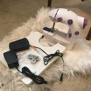 99% new!!Mini Portable Sewing Machine
